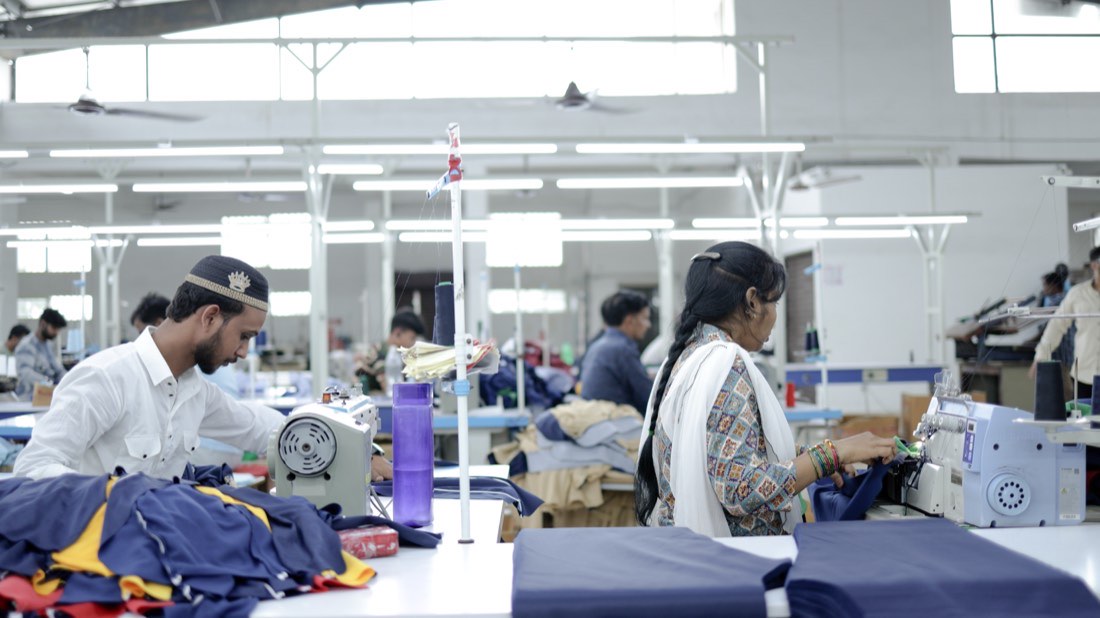 Rows of machines with garments in progress