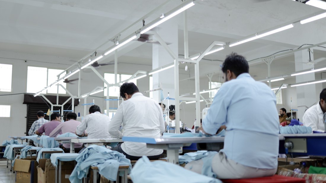 Operators working along the production floor