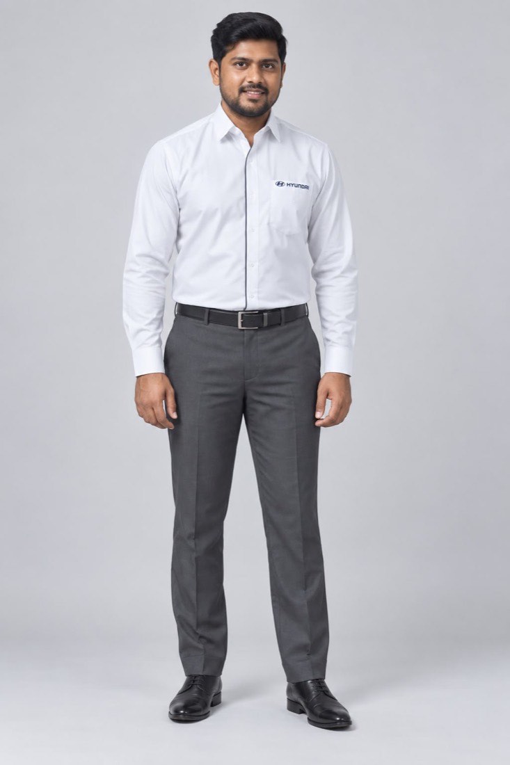 Dealership uniform manufactured for Hyundai — white shirt with embroidered chest branding and grey trousers